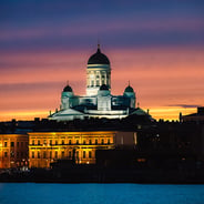 vertical-shot-helsinki-cathedral-surrounded-by-lights-during-sunset-finland